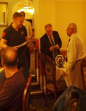 Jon Hunt receives award from Percy Bulsara