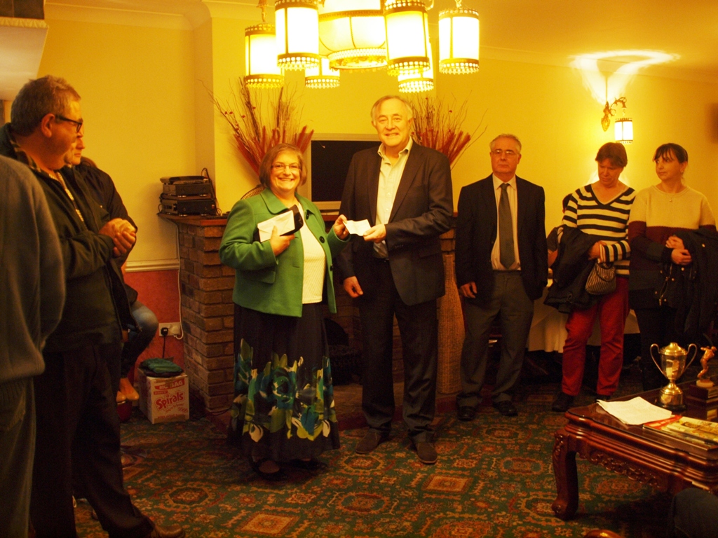 Carolyn presenting cheque to Dr Crawford