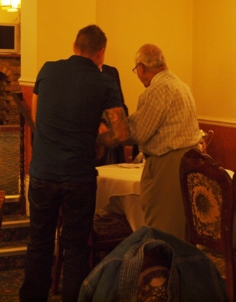 Steve Saberton receives award from Percy Bulsara